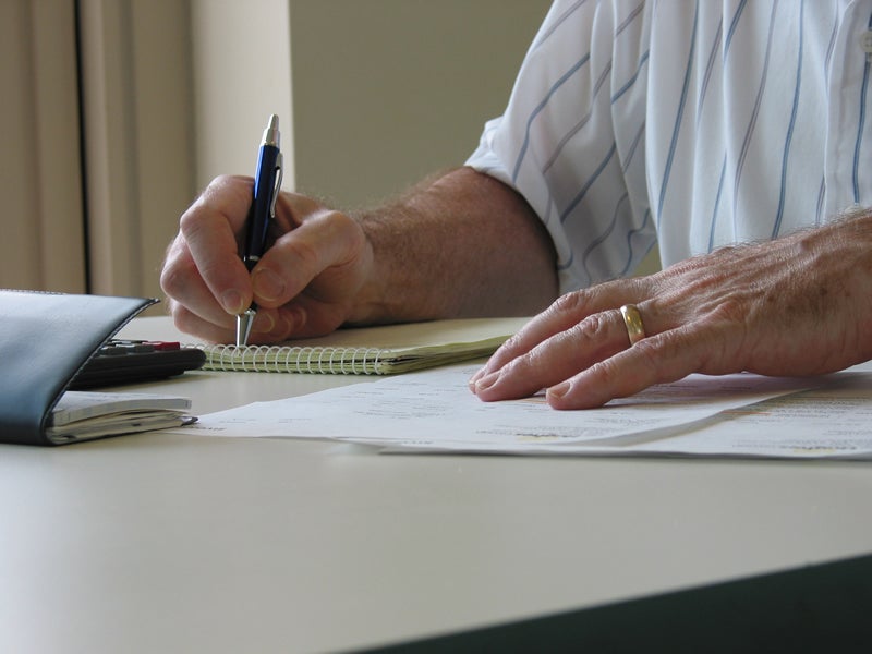 Member filling out paperwork